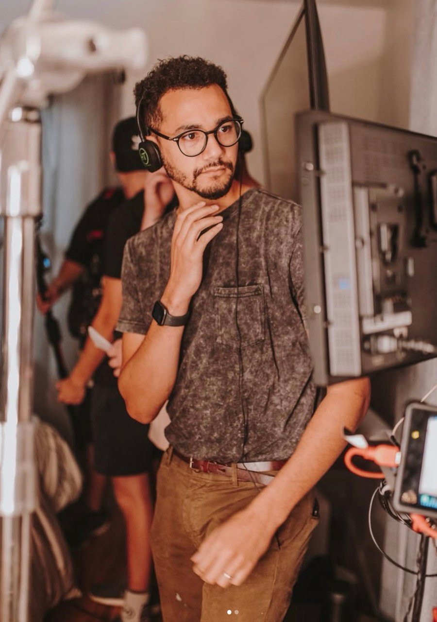 Trey Ellis, founder of Ads by Friday, wearing a headset on set